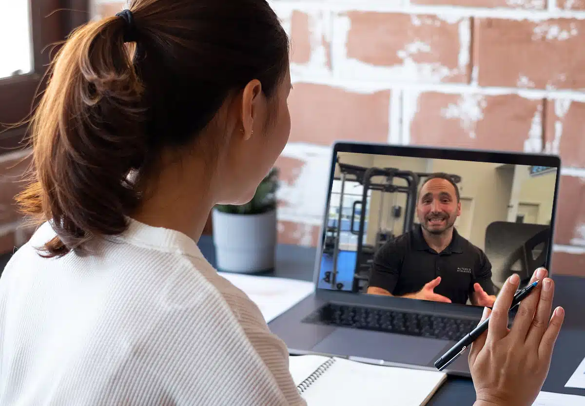 Woman waving hi to Jared during a virtual meeting